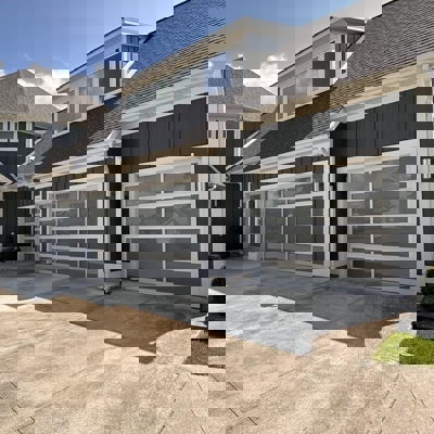 Modern glass garage doors with a white frame Photo