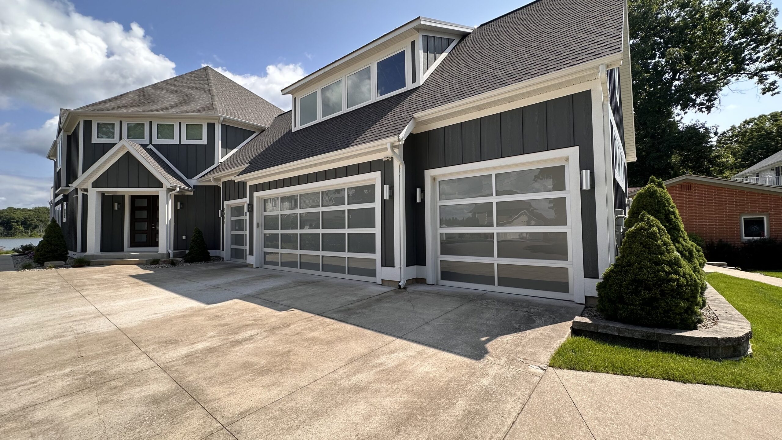 Modern glass garage doors with a white frame Photo